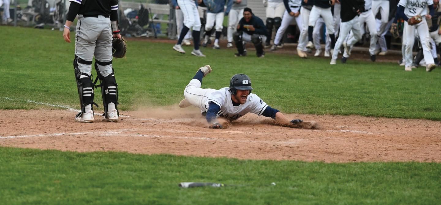 Garrison Ferone sliding onto home base.